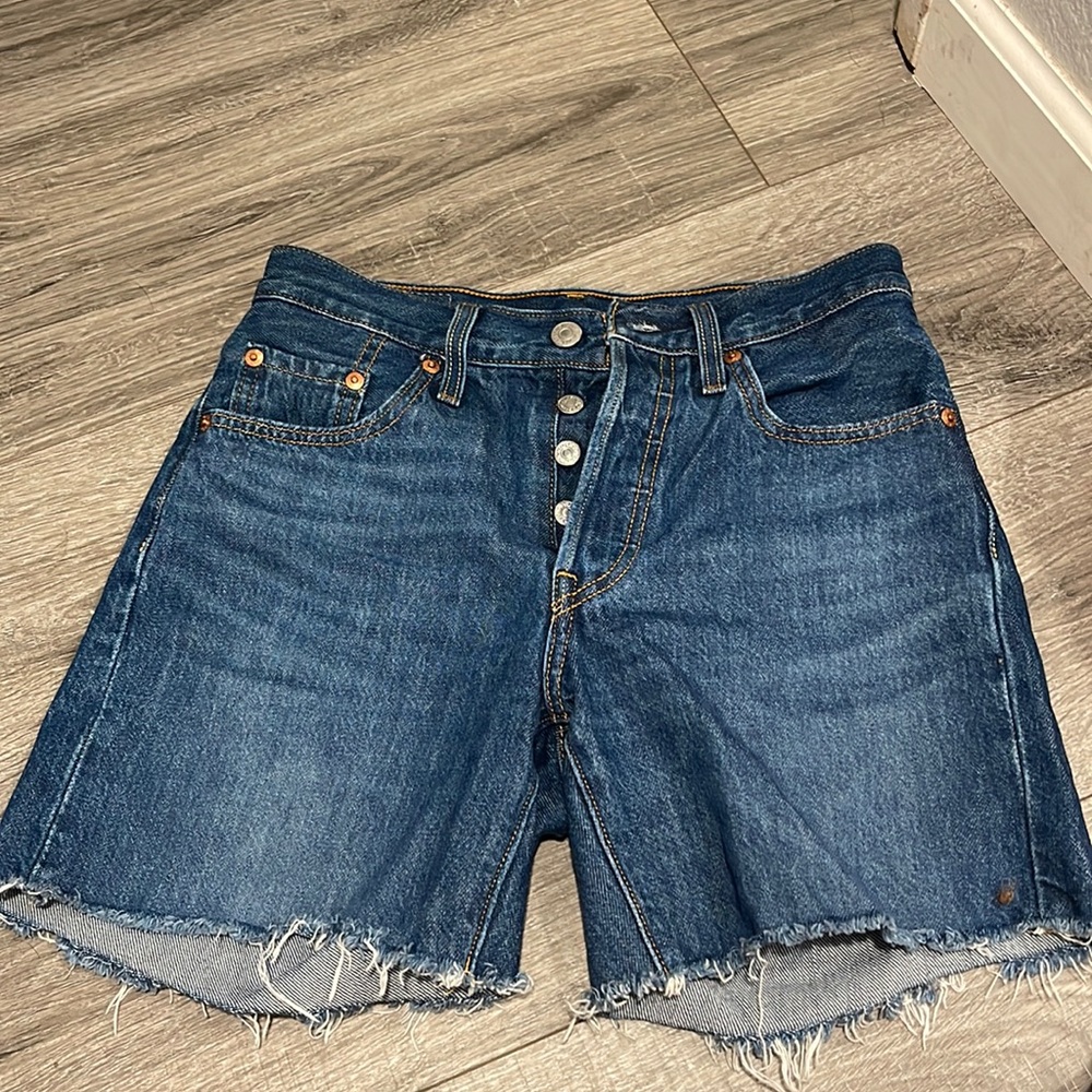 Levi’s High rise size 24, fits 25 waist as well. Denim shorts, medium dark wash